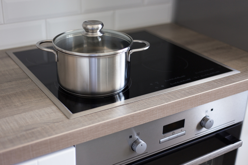 steel pot on stove in modern kitchen