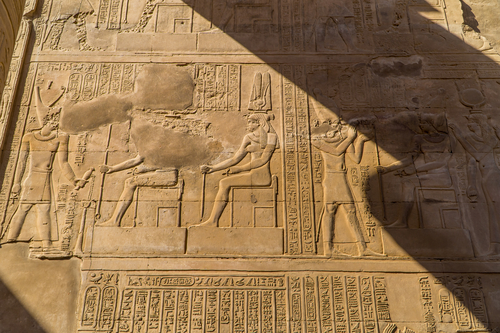 A shot of Egyptian hieroglyphs and engravings on the walls of Kom Ombo Temple, Egypt