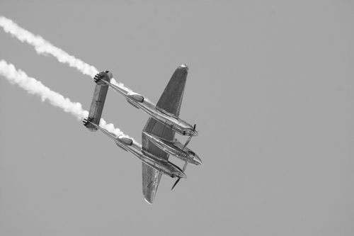 Double tail plane P-38 "Lightning" in airshow, white and black photo