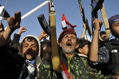YEMEN, Sanaa : Shiite-Houthi supporters raise rifles during a demonstration in Sanaa on October 2, 2015, against ongoing military operations carried out by the Saudi-led coalition.