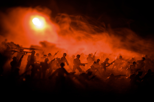War Concept. Military silhouettes fighting scene on war fog sky background, World War Soldiers Silhouettes Below Cloudy Skyline At night. Attack scene. Armored vehicles. Selective focus. Decoration