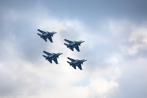 Novosibirsk, Russia, July 31, 2016, Mochishche airfield, local air show, Aerobatic team VKS "Russian Falcons" Su-30 SM, four russian fighter aircrafts in the blue coudy sky