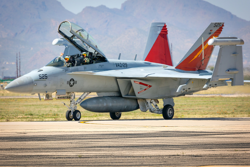 Two Naval Aviators return after performing a demonstration of the EA-18G Growler at the 2023 Thunder and Lightning Over Arizona airshow in Tucson, Arizona.