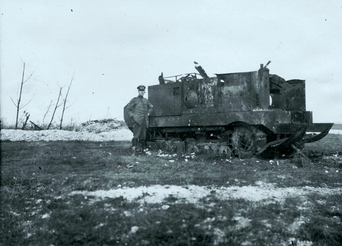 German soldier posing at nearby destroyed french St.Chermain tank