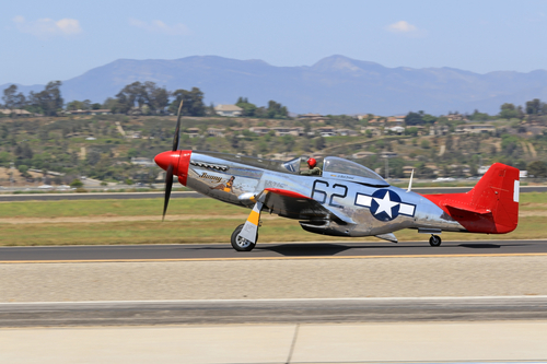 Airplane vintage WWII P-51 Mustang "red tail" performing at 2016 Camarillo Air Show