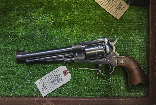 Contemporary reproduction of a vintage black powder cap and ball Ruger Old Army revolver at a gun shop