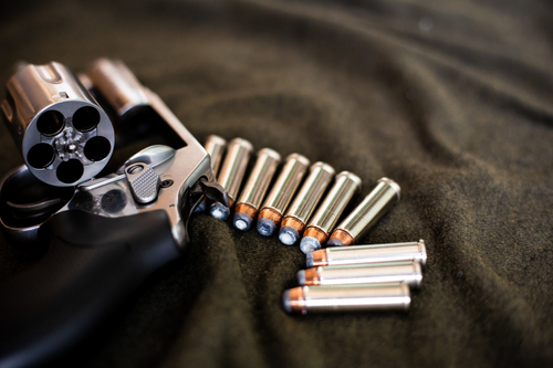 357 magnum revolver classic gun with bullet on cloth background