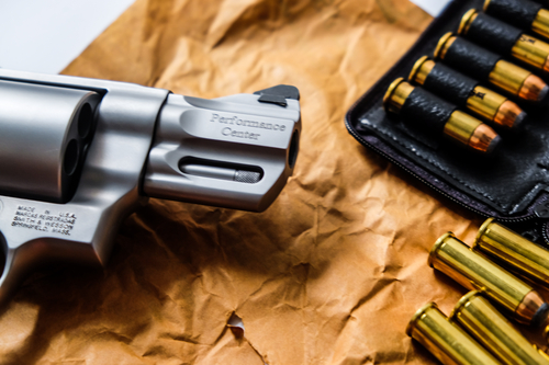 Revolver metal .44 .357 magnum gun with jacket soft point bullet close up