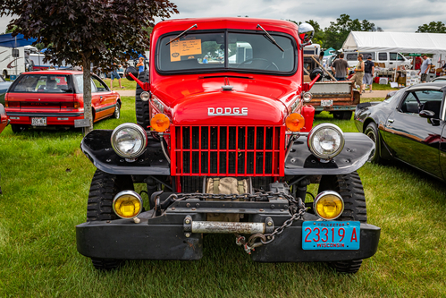 Iola, WI - July 07, 2022: High perspective front view of a 1949 Dodge Power Wagon 1 Ton Pickup Truck at a local car show.