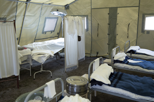 inside a tent mobile military hospital, empty beds. installation of the second world war soviet russia