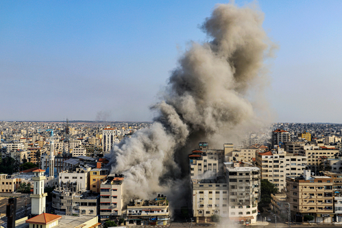 (INT) Smoke and flames billow after Israeli forces hit a high-rise tower in Gaza City. October10, 2023, Gaza, Palestine: Palestinian militants have started a "war" against Israel, infiltrating by air, sea and land from the blockaded Gaza Strip