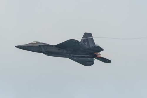 Singapore - Feb 12, 2020. USAF Lockheed Martin F-22 Raptor flying for display in Changi, Singapore. Defense costs are increasing, especially in East Asia.