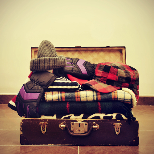 warming clothes in a suitcase