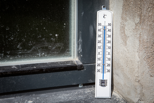 Sunny and very extreme hot weather. Dirty outdoor windowsill. Outdoor thermometer