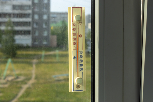 Thermometer outside the window shows a abnormal hot temperature outside