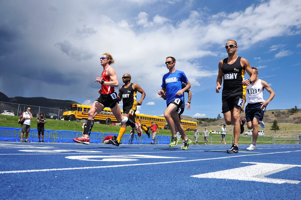 Athletes sprint starting line men’s