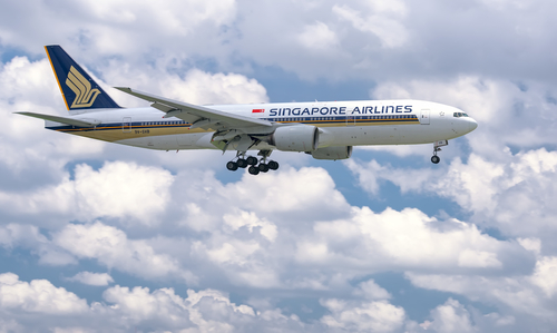 Ho Chi Minh City, Vietnam - June 8th, 2019: Airplane Boeing 777 of Singapore Airlines flying through clouds sky prepare to landing at Tan Son Nhat International Airport, Ho Chi Minh City, Vietnam