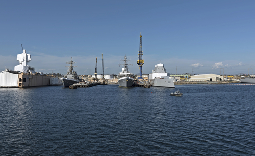 San Diego, California, USA - March 17, 2023: Naval Base San Diego, principal home port of the Pacific Fleet. Showing Zumwalt-class destroyer ship.